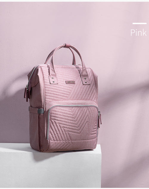 Pink backpack with a chevron pattern on a light pink background